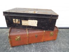 A vintage wood bound cabin trunk and a metal chest.