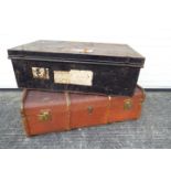A vintage wood bound cabin trunk and a metal chest.