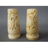 Two carved bone ornamental stands,