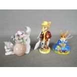 Two Royal Doulton figurines comprising Daisie Bunnykins, Mr Bunnykins and a Lladro kitten,