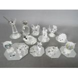 A collection of Swarovski crystal figures, predominantly animals, to include owls, hedgehog,