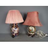 Two Oriental vases converted to table lamps.