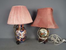 Two Oriental vases converted to table lamps.