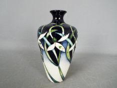 Moorcroft - a Moorcroft vase in the Twenty Winters design,