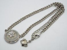 Butler & Wilson - a Butler & Wilson necklace with stone set circular pendant with star,