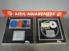 Two framed commemorative discs for album sales comprising Kaiser Chiefs 'Yours Truly,