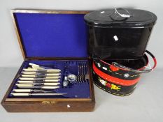 Lot to include an oak cased canteen of cutlery, bread bin and hand painted barge ware mop bucket.