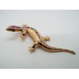 Butler & Wilson - a Butler & Wilson rose gold coloured stone set brooch in the form of a lizard,