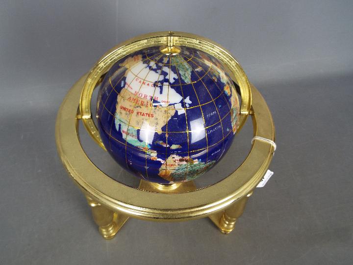 A gemstone terrestrial globe on brass stand, approximately 24 cm (h). - Image 2 of 3