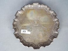 A George VI hallmarked silver salver or card tray of scalloped outline,