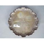 A George VI hallmarked silver salver or card tray of scalloped outline,