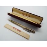 A Yard O Led hallmarked silver propelling pencil with engine turned decoration,