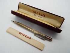 A Yard O Led hallmarked silver propelling pencil with engine turned decoration,