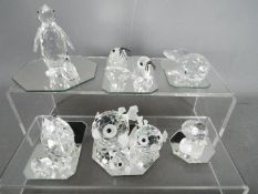 A collection of Swarovski crystal figures, predominantly animals, to include puffer fish, penguins,