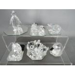 A collection of Swarovski crystal figures, predominantly animals, to include puffer fish, penguins,
