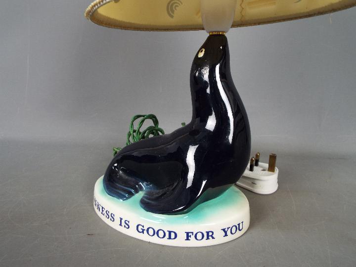 Breweriana - A Guinness advertising table lamp by Carlton Ware modelled as a sealion, - Image 4 of 5