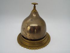 A brass counter top bell