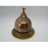 A brass counter top bell