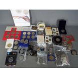 A collection of coins, commemorative crowns, coin sets,