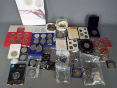 A collection of coins, commemorative crowns, coin sets,