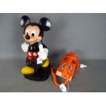 A vintage Tyco Mickey Mouse telephone and a retro orange telephone.