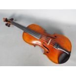 Violin - A late 19th / early 20th century violin, two piece back,