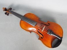 Violin - A late 19th / early 20th century violin, two piece back,
