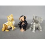 Beswick - Three Beswick animal figurines comprising Chimpanzee, Lion Cub and Elephant Calf,