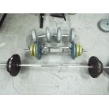 Fitness Equipment - A quantity of dumbells and weights.