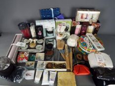 Lot to include dressing table items, cosmetic and toiletries gift sets, purses,