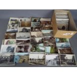 In excess of 500 early-mid period UK foreign and subject postcards to include real photos,