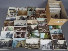 In excess of 500 early-mid period UK foreign and subject postcards to include real photos,