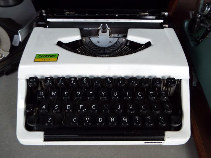 Two portable typewriters, one an Imperial 'Good Companion' and a vintage dial telephone. - Image 2 of 4