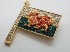 Butler & Wilson - a Butler & Wilson stone set brooch in the form of a Welsh flag,