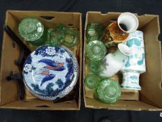 A collection of uranium glass and Japanese ceramics comprising vases and plates.