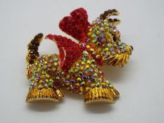 Butler & Wilson - a Butler & Wilson stone set brooch in the form of a West Highland Terrier,