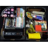 A mixed lot to include DVD's and CD's, boxed set of pool balls, glassware,
