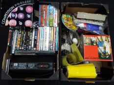 A mixed lot to include DVD's and CD's, boxed set of pool balls, glassware,