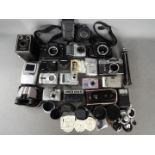 Photography - A collection of cameras and photographic equipment to include a Zenit EM, Pentax P30,