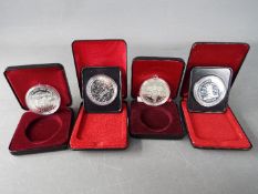 Four silver 1 dollar Canada coins comprising 1977, 1978, 1982 and 1995, all cased.