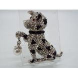 Butler & Wilson - a Butler & Wilson stone set brooch in the form of a sitting dog,