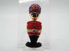 Butler & Wilson - a Butler & Wilson stone set brooch in the form of a Beefeater,