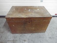 A large wooden trunk or tool chest with hinged lid, approximately 47 cm x 76 cm x 46 cm.