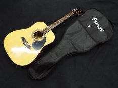 A Spur six string acoustic guitar in case.