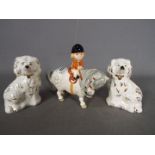 A pair of Staffordshire style Beswick spaniels and a Beswick,