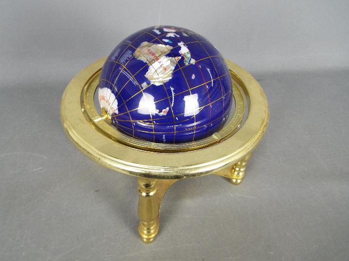 A gemstone terrestrial globe on brass stand, approximately 24 cm (h). - Image 3 of 3