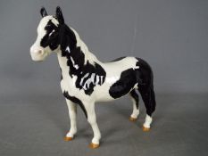 Beswick - a Beswick black and white Piebald Pinto pony, 16 cm.