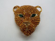 Butler & Wilson - a Butler & Wilson stone set brooch in the form of a leopard's head,