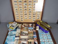 Cigarette Cards - A collection of cigarette and tea cards,