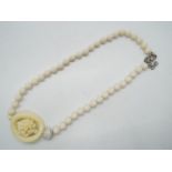 A lady's stone set beaded necklace with Butler & Wilson logo